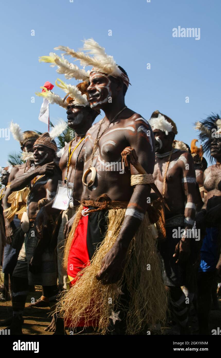 Asmat men stand in line during the Asmat Festival held in Ancol, Jakarta. Stock Photo
