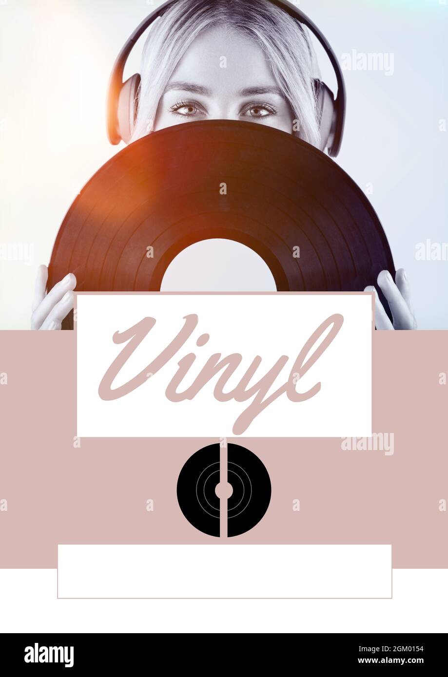 Vinyl text against female musician wearing headphones holding a vinyl record against grey background Stock Photo