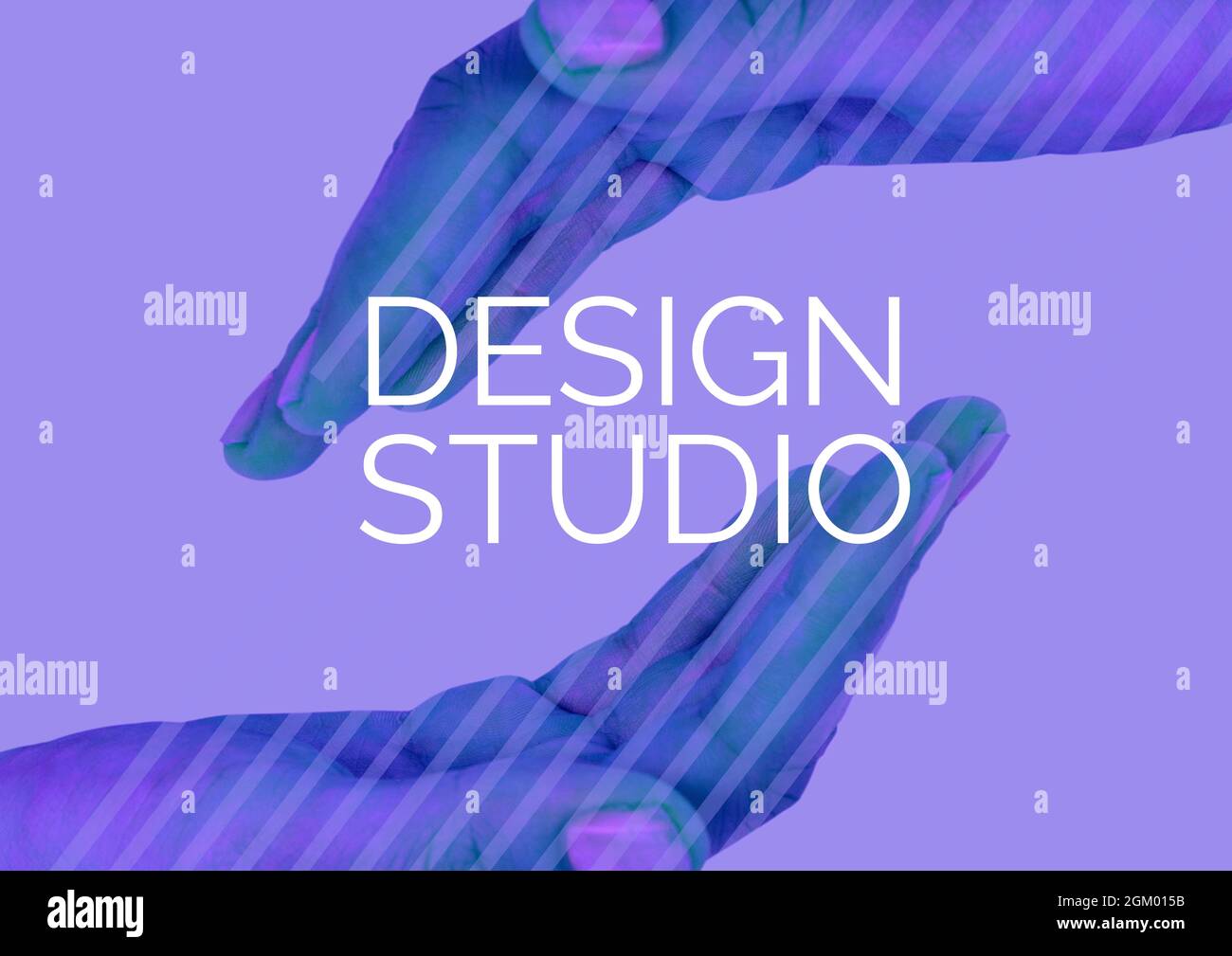 Digitally generated image of design studio text over two hands against purple background Stock Photo