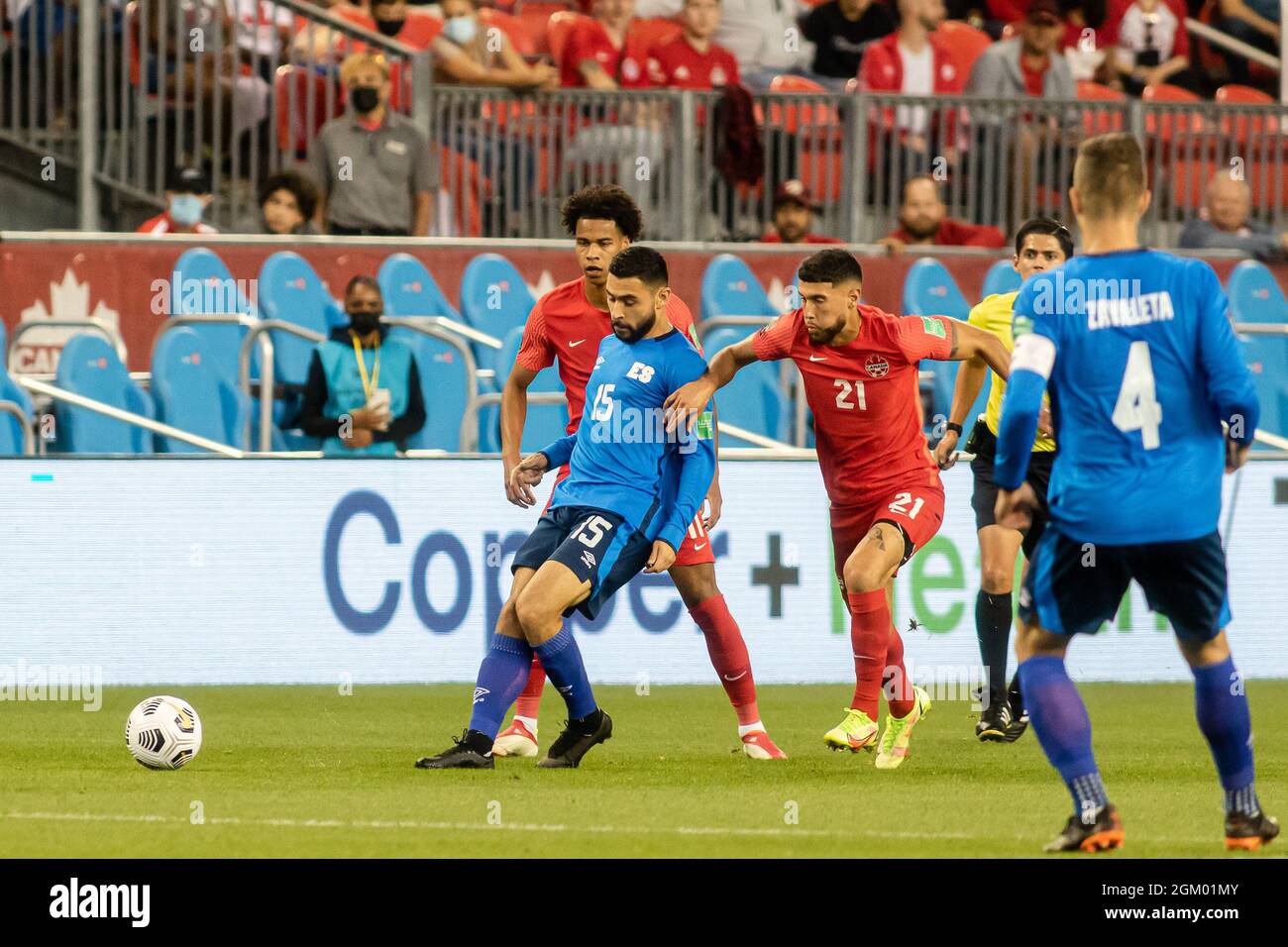 Toronto, Canada, September 8, 2021: Alex Roldan (No.15) of Team El Salvador in action against Jonathan Osorio (No.21) and Tajon Buchanan (No.11) of Team Canada during the CONCACAF FIFA World Cup Qualifying 2022 match at BMO Field in Toronto, Canada. Canada won the match 3-0. Stock Photo