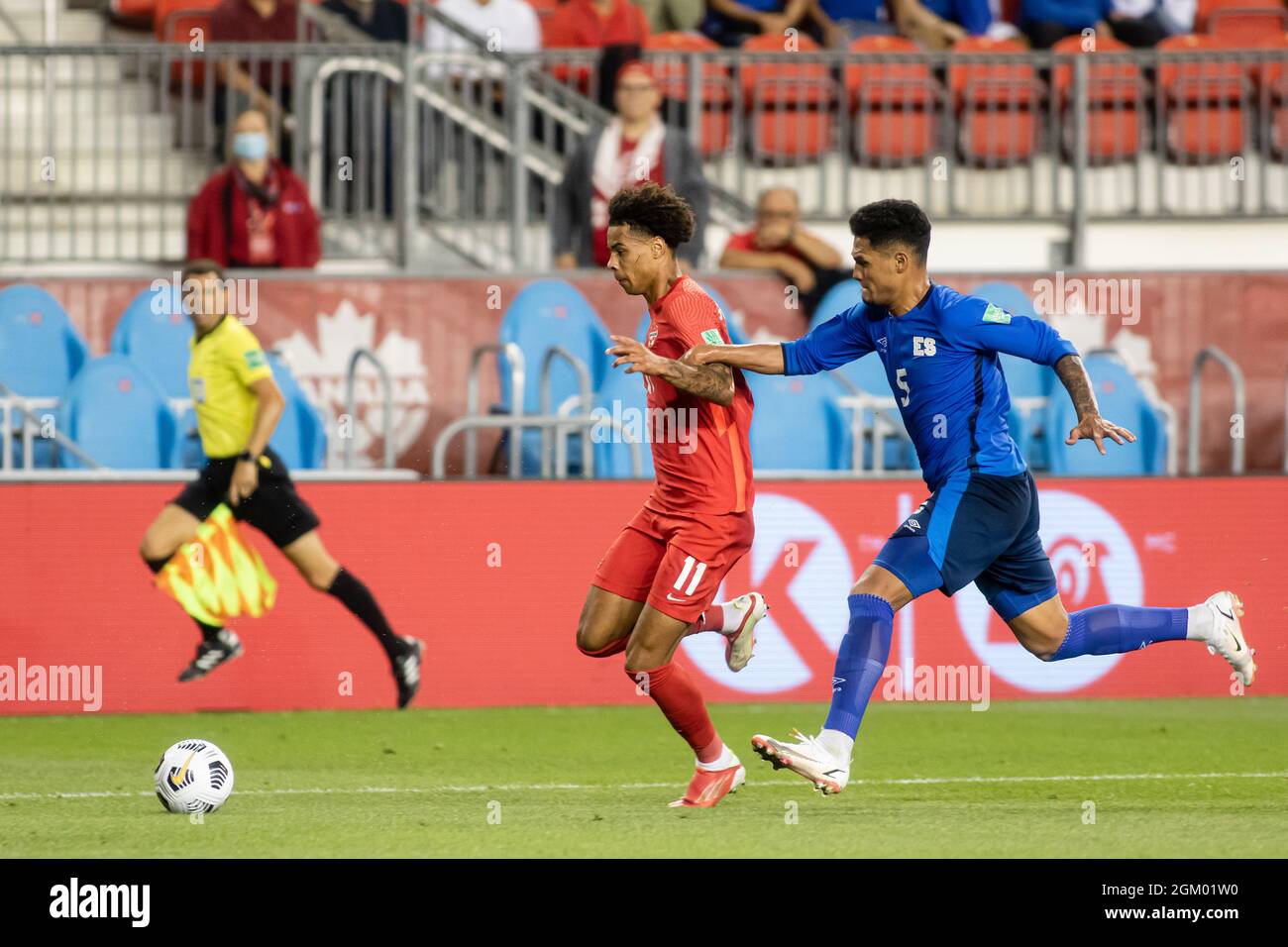 Toronto, Canada, September 8, 2021: Tajon Buchanan (No.11) of Team Canada competes for the ball against Ronald Gómez (No.5) of Team El Salvador during the CONCACAF FIFA World Cup Qualifying 2022 match at BMO Field in Toronto, Canada. Canada won the match 3-0. Stock Photo