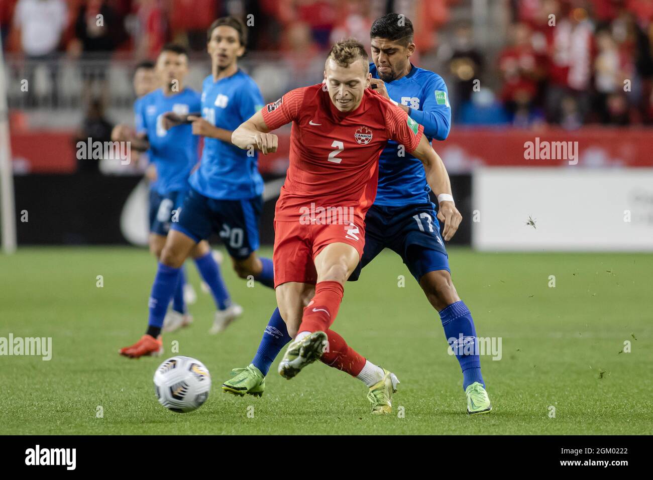 Toronto, Canada, September 8, 2021: Alistair Johnston (No.2) of Team Canada compete for the ball against Jairo Henríquez (No.17) of Team El Salvador during the CONCACAF FIFA World Cup Qualifying 2022 match at BMO Field in Toronto, Canada. Canada won the match 3-0. Stock Photo