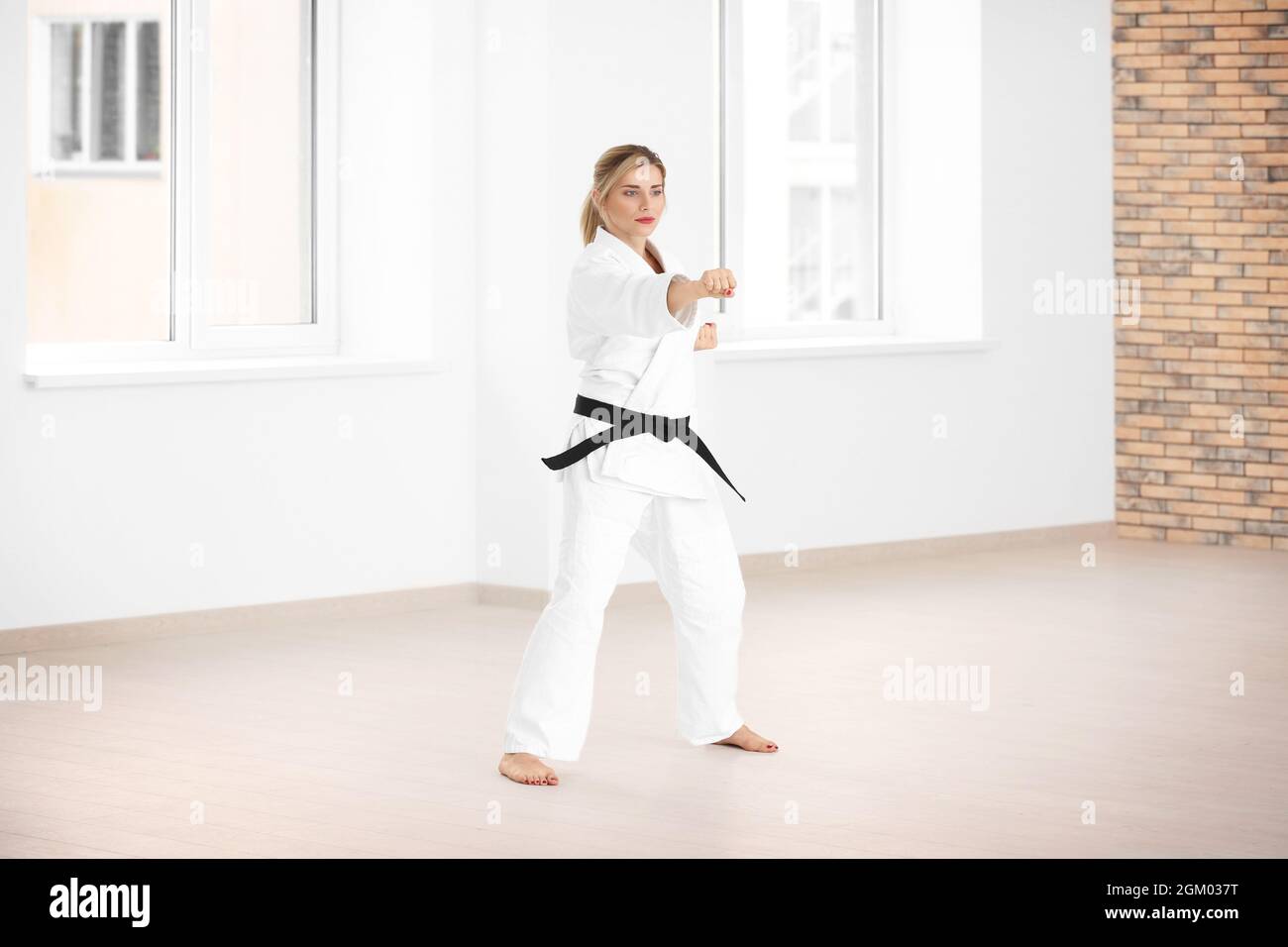 Female karate instructor training in dojo Stock Photo Alamy