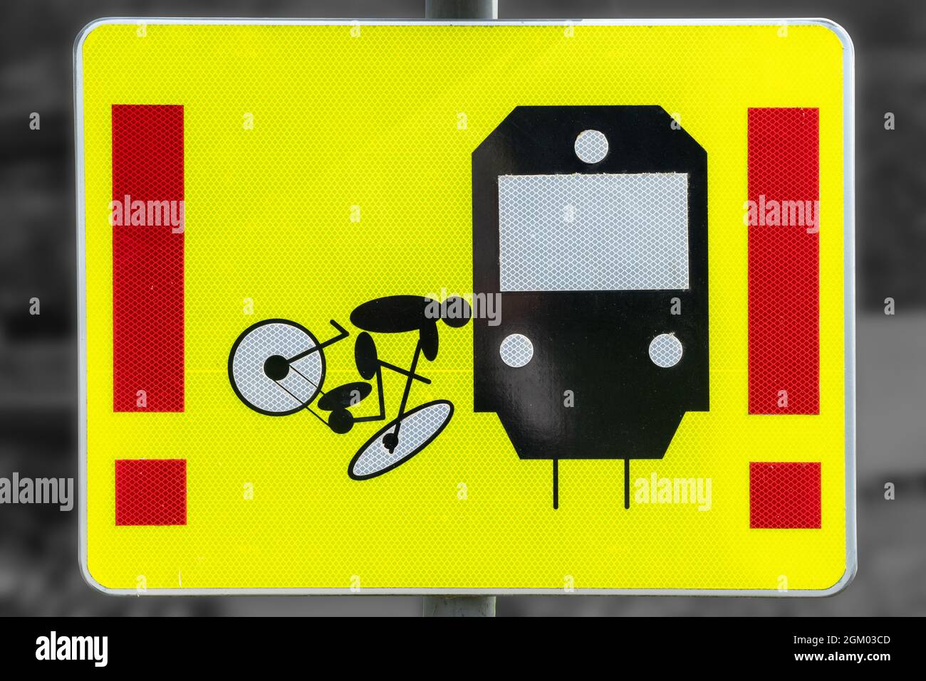 Tram warning sign for bicycles on yellow background. Tram crosses the path of cyclists Stock Photo