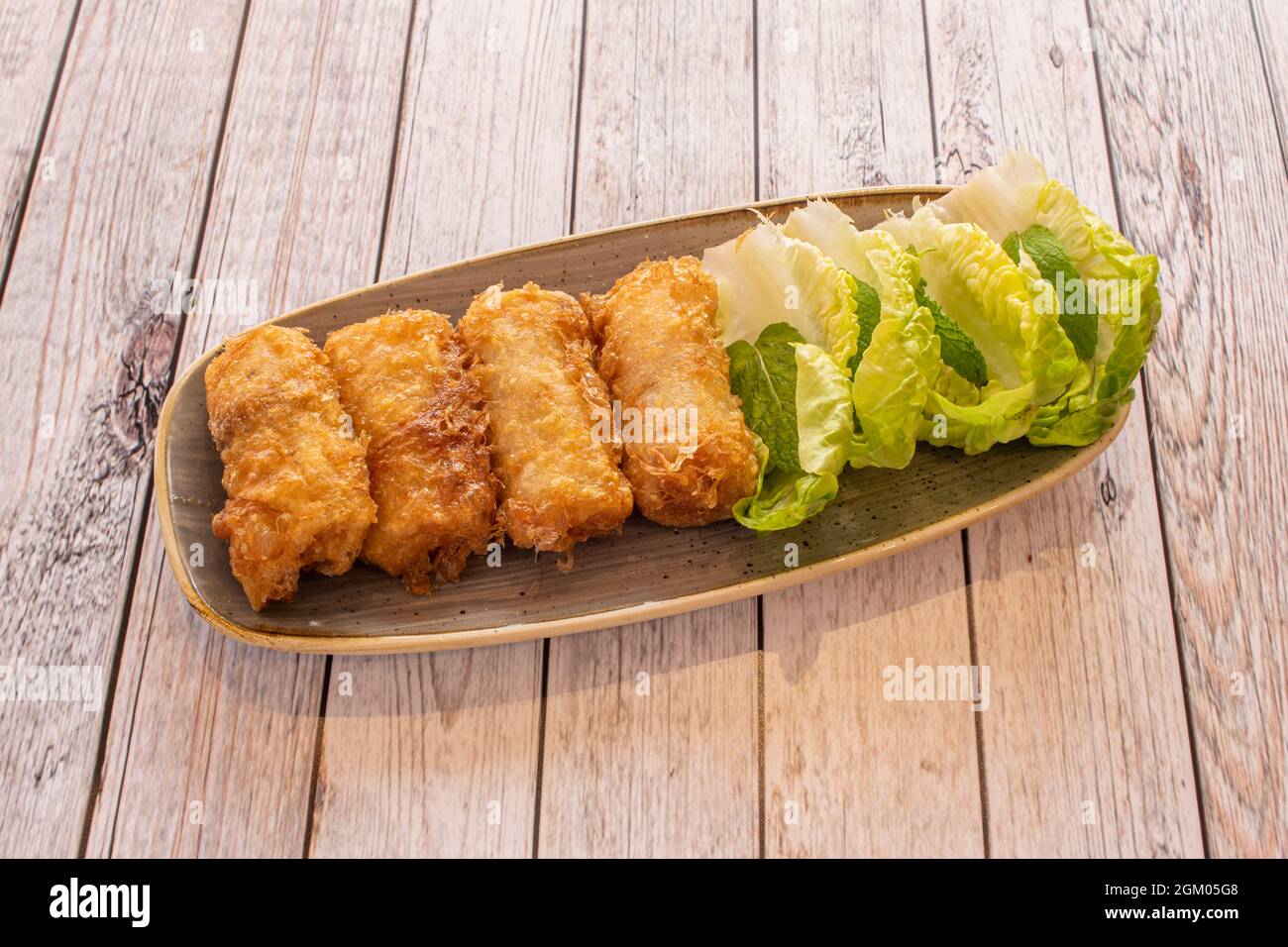 Crispy breaded Vietnamese nems rolls stuffed with chicken and prawns