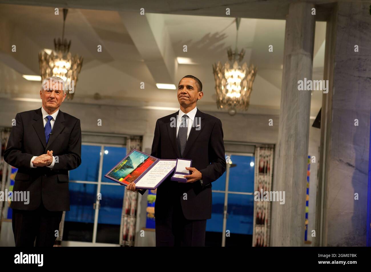 Nobel Committee Chairman Thorbjorn Jagland presents President Barack Obama with the Nobel Prize medal and diploma during the Nobel Peace Prize ceremony in Raadhuset Main Hall at Oslo City Hall in Oslo, Norway, Dec. 10, 2009. (Official White House Photo by Samantha Appleton) This official White House photograph is being made available only for publication by news organizations and/or for personal use printing by the subject(s) of the photograph. The photograph may not be manipulated in any way and may not be used in commercial or political materials, advertisements, emails, products, promotions Stock Photo
