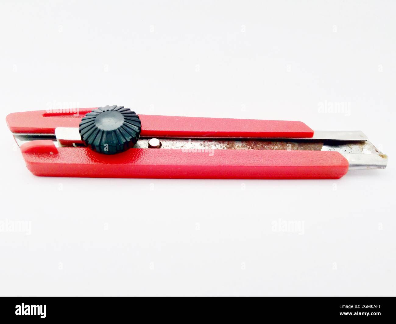 Used cutter on an isolated white background Stock Photo - Alamy