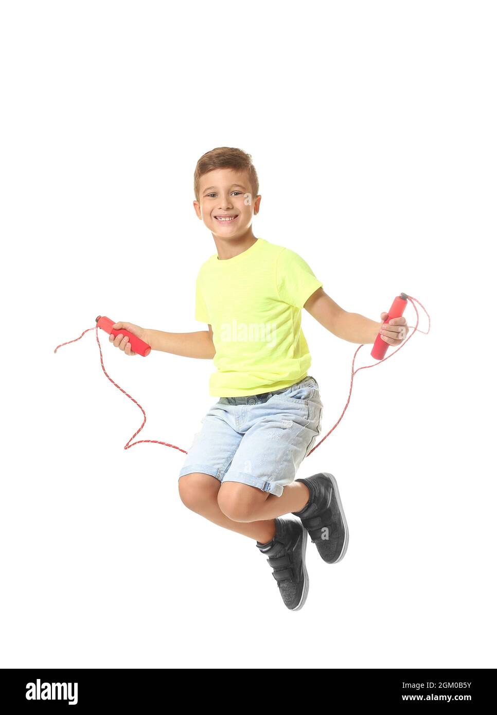 Adorable boy skipping rope, isolated on white Stock Photo - Alamy