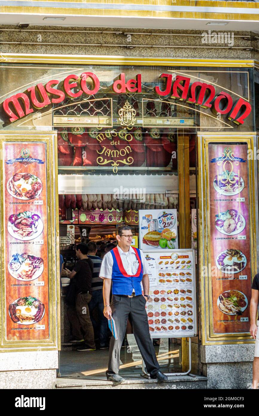 Madrid Spain,Centro Carrera de San Jeronimo,Museo del Jamon Museum of Ham,entrance restaurant Hispanic man male worker employee Stock Photo