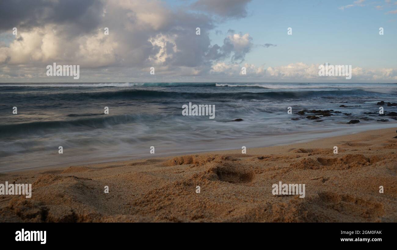 Morning on Poipu Beach in Kauai using long exposure to create milky