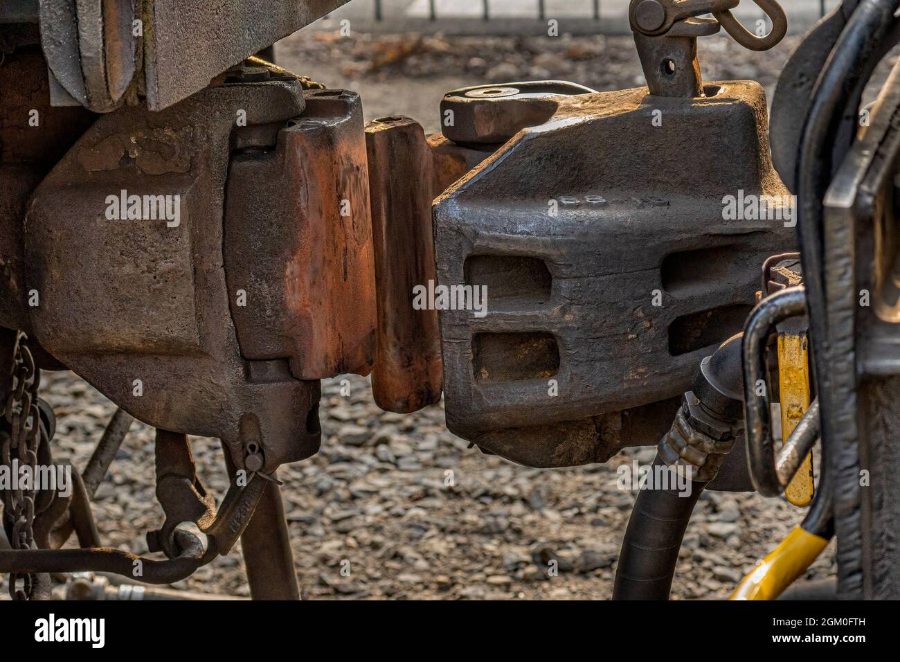 Railroad car coupling: The shiny, worn metal shows that it's just a moment before coupling is accomplished. Stock Photo