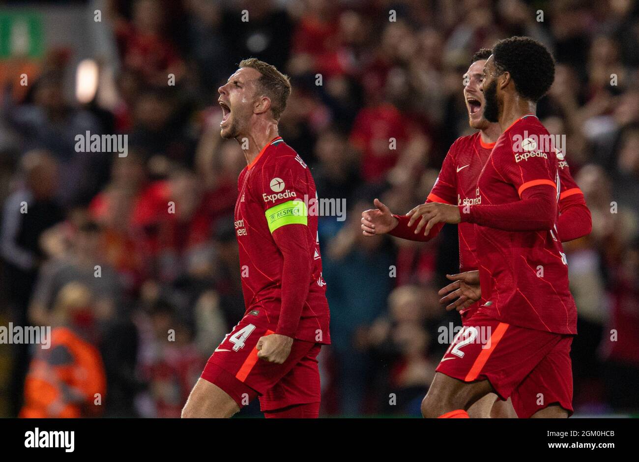 Liverpool. 16th Sep, 2021. Liverpool's captain Jordan Henderson (L)  celebrates after scoring the winning third goal during the UEFA Champions  League Group B match between Liverpool and AC Milan at Anfield in