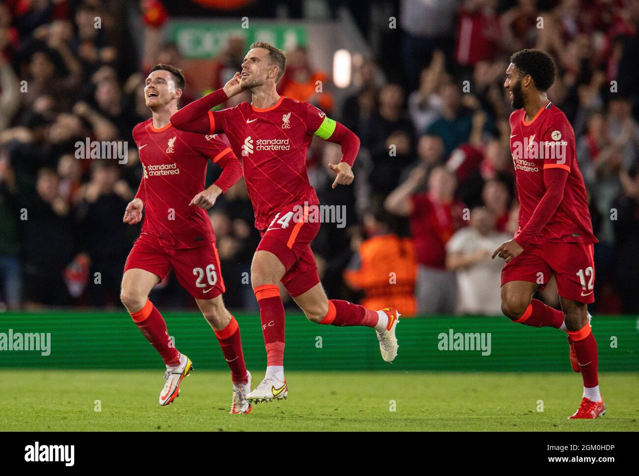 Liverpool. 16th Sep, 2021. Liverpool's captain Jordan Henderson (C) celebrates after scoring the winning third goal during the UEFA Champions League Group B match between Liverpool and AC Milan at Anfield in Liverpool, Britain, on Sept. 15, 2021. Credit: Xinhua/Alamy Live News Stock Photo