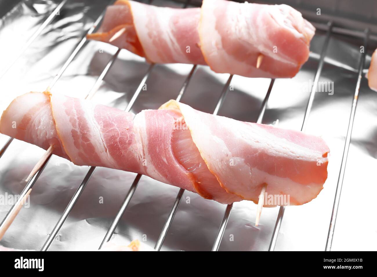 Bacon wrapped chicken nuggets on baking rack, closeup Stock Photo Alamy