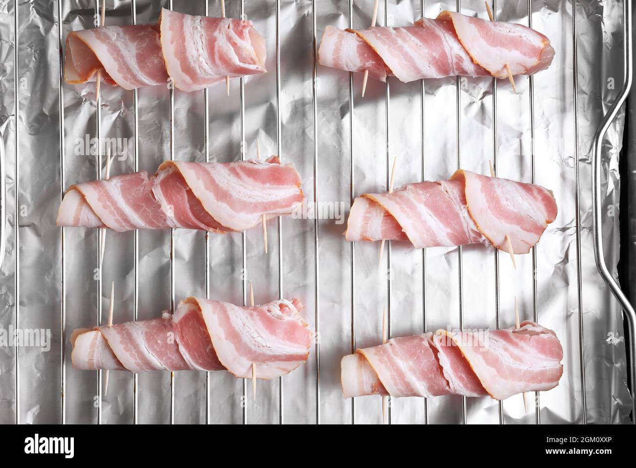 Bacon wrapped chicken nuggets on baking rack Stock Photo Alamy