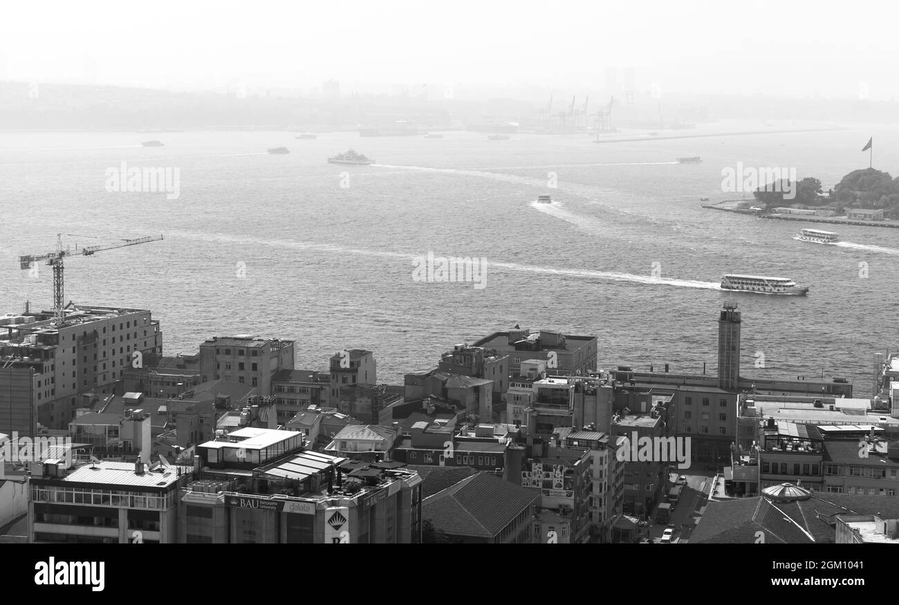 Istanbul, Turkey - July 1, 2016:  Cityscape of Istanbul with ships at Bosporus, black and white photo Stock Photo