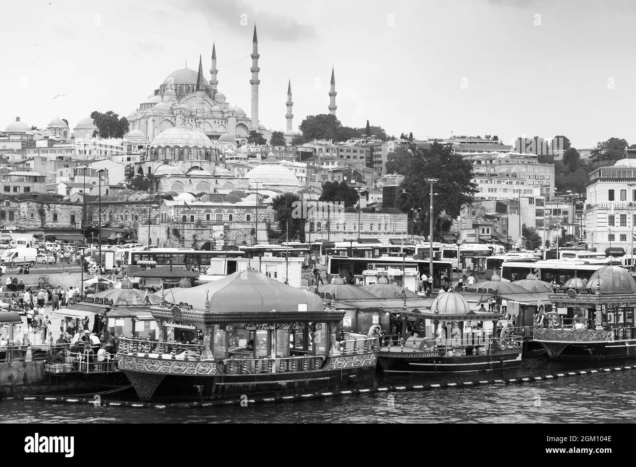 Istanbul, Turkey - June 28, 2016: Istanbul Cityscape with Eminonu former district. Ordinary people are on the coast of Golden Horn, Suleymaniye Mosque Stock Photo
