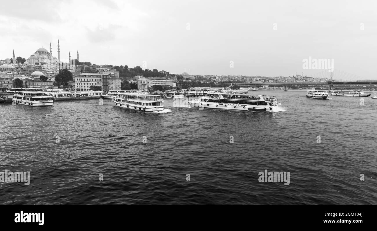 Istanbul, Turkey - June 28, 2016: Istanbul landscape. Passenger ships are at the Golden Horn, black and white photo Stock Photo