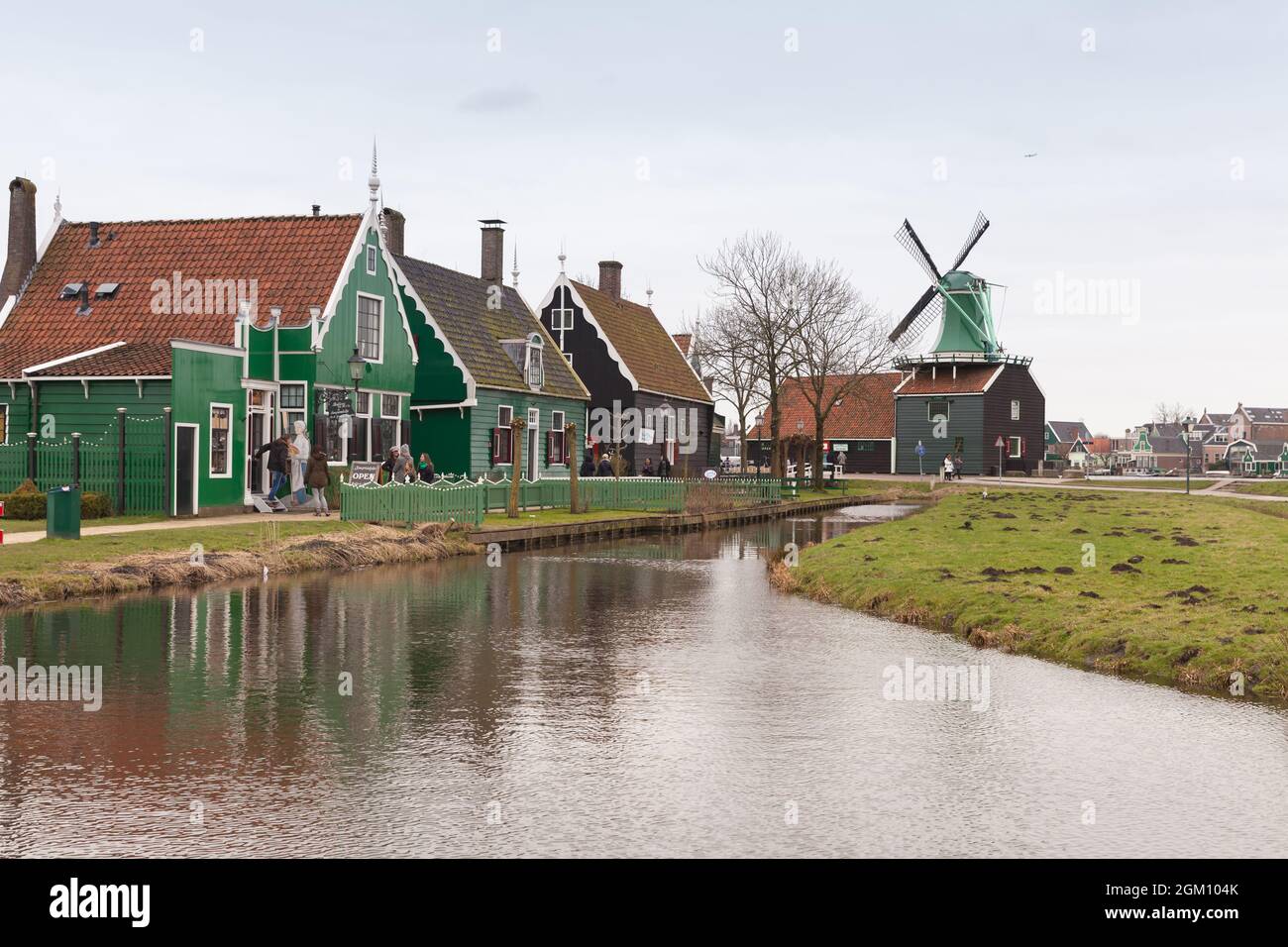 Zaanse Schans, Netherlands - February 25, 2017: Zaanse Schans historic town view with walking people, popular tourist attraction of Netherlands Stock Photo