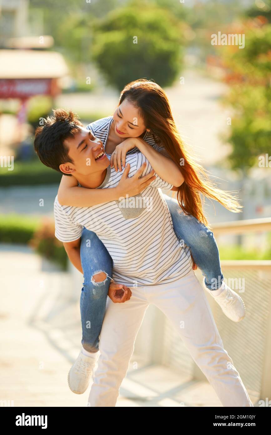 Download Cute Korean Couple Piggyback Ride Wallpaper