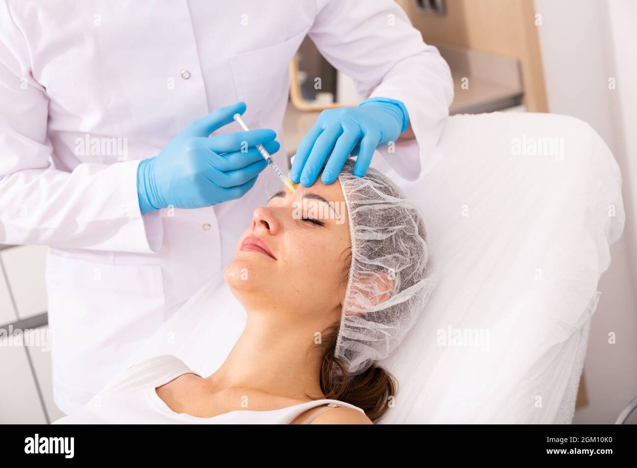 Woman getting facial contouring injections Stock Photo Alamy