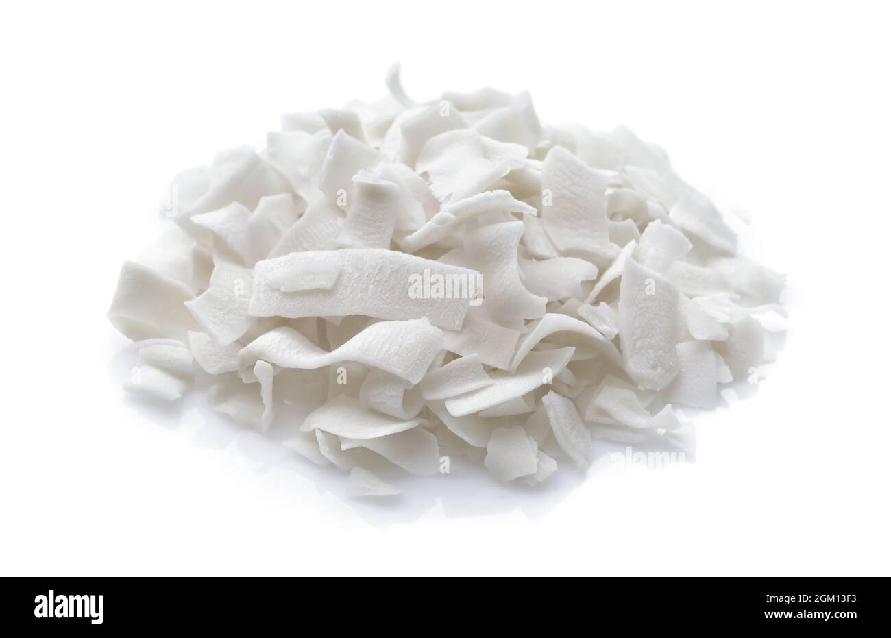 Pile of dehydrated organic coconut chips isolated on white Stock Photo