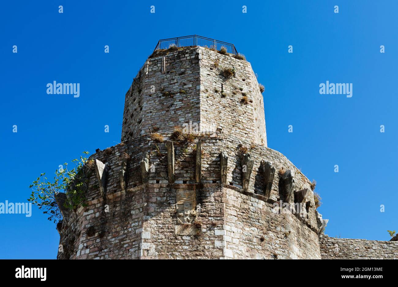Assisi, Italy , polygonal tower of Rocca Maggiore fortress reconstructed in 1356, medieval military architecture Stock Photo