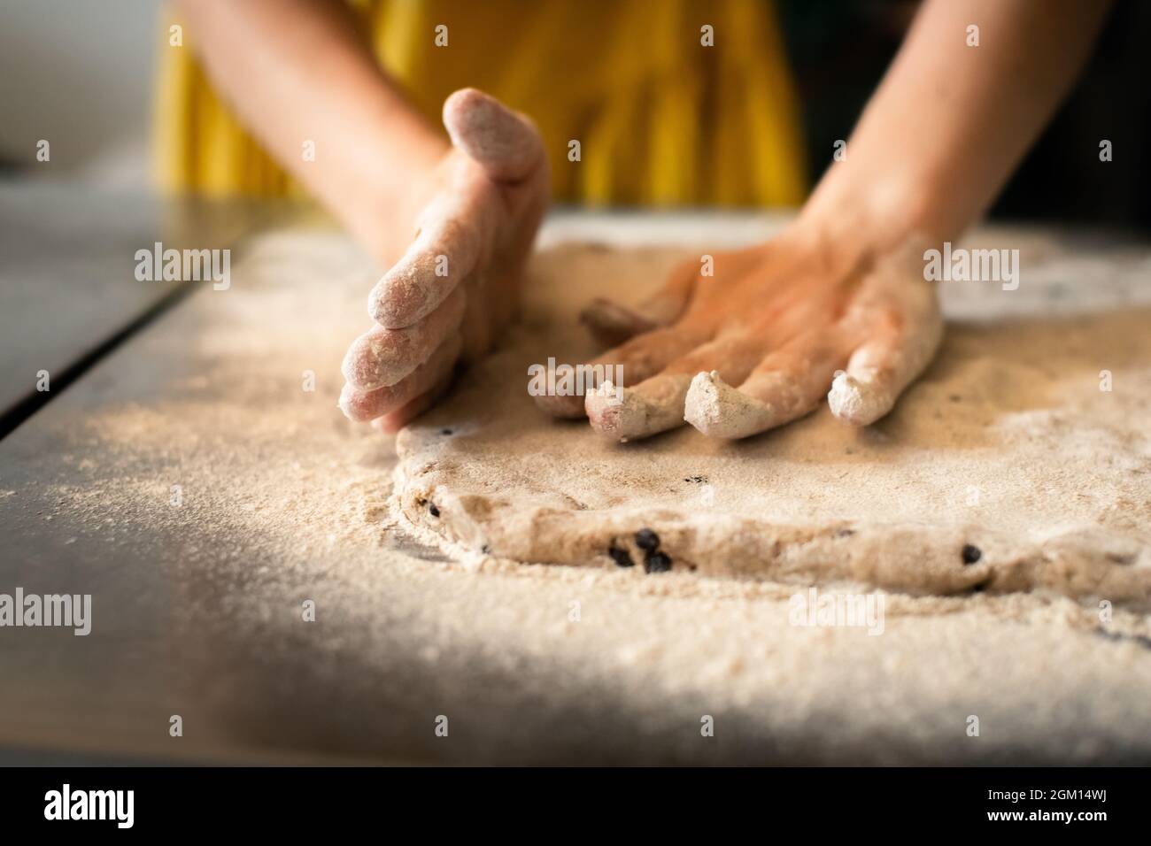 Molding rye sticks with chocolate and hazelnuts by a woman Stock Photo ...