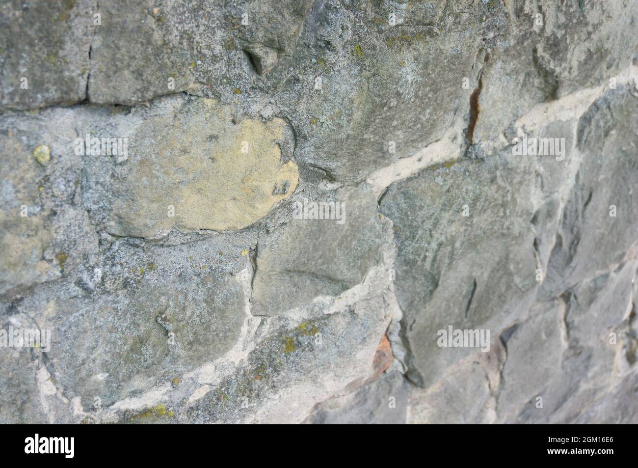 Old stone wall texture with cement joints Stock Photo