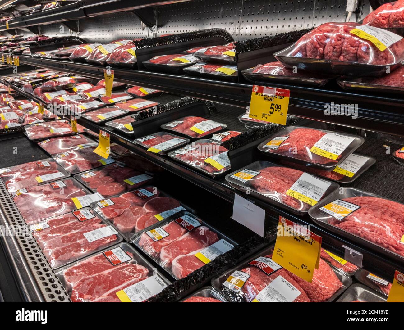 Woodinville WA USA - circa September 2021: Angled view of the refrigerated meats section inside a Haggen grocery store. Stock Photo