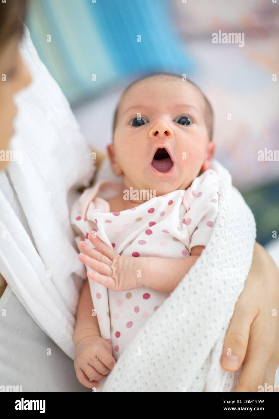 Newborn baby open its mouth and showing tongue Stock Photo Alamy