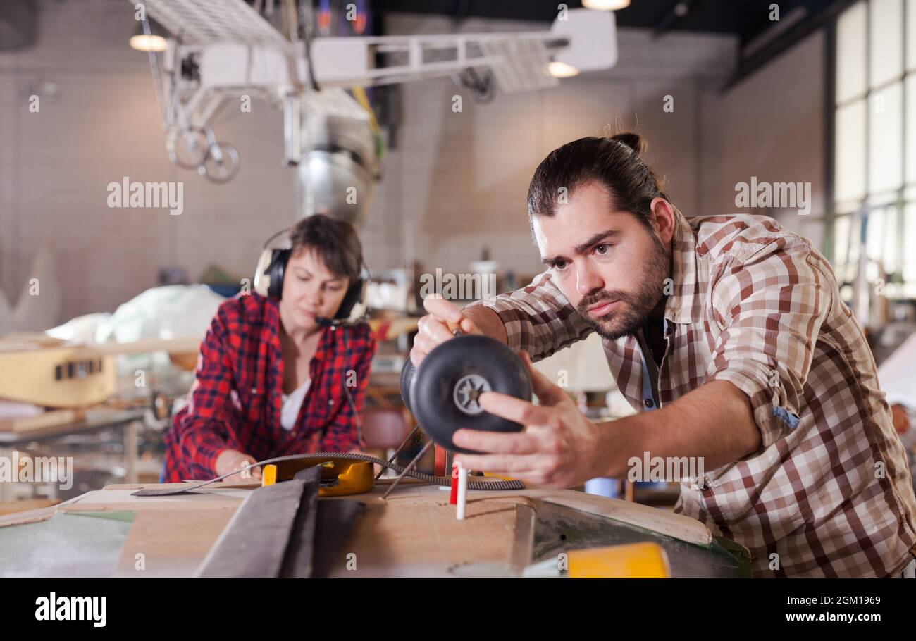 Male creating airplane models Stock Photo