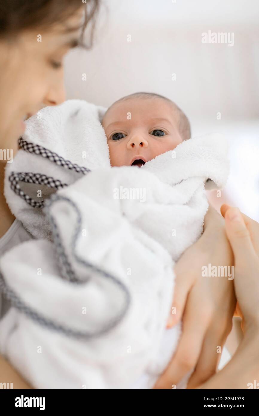 Newborn baby open its mouth and showing tongue Stock Photo Alamy