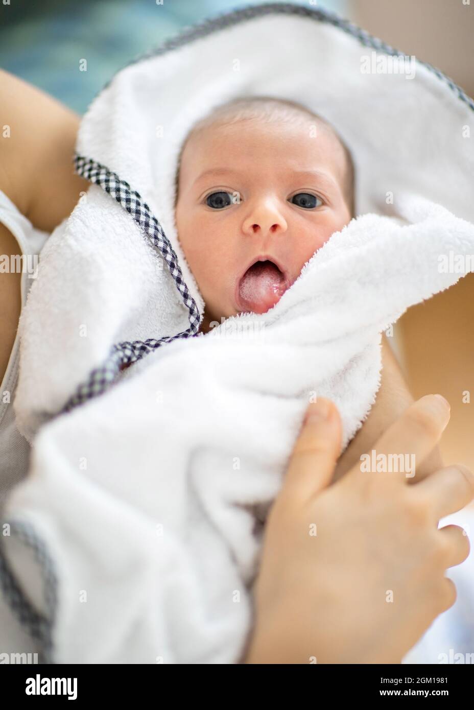 Newborn baby open its mouth and showing tongue Stock Photo Alamy