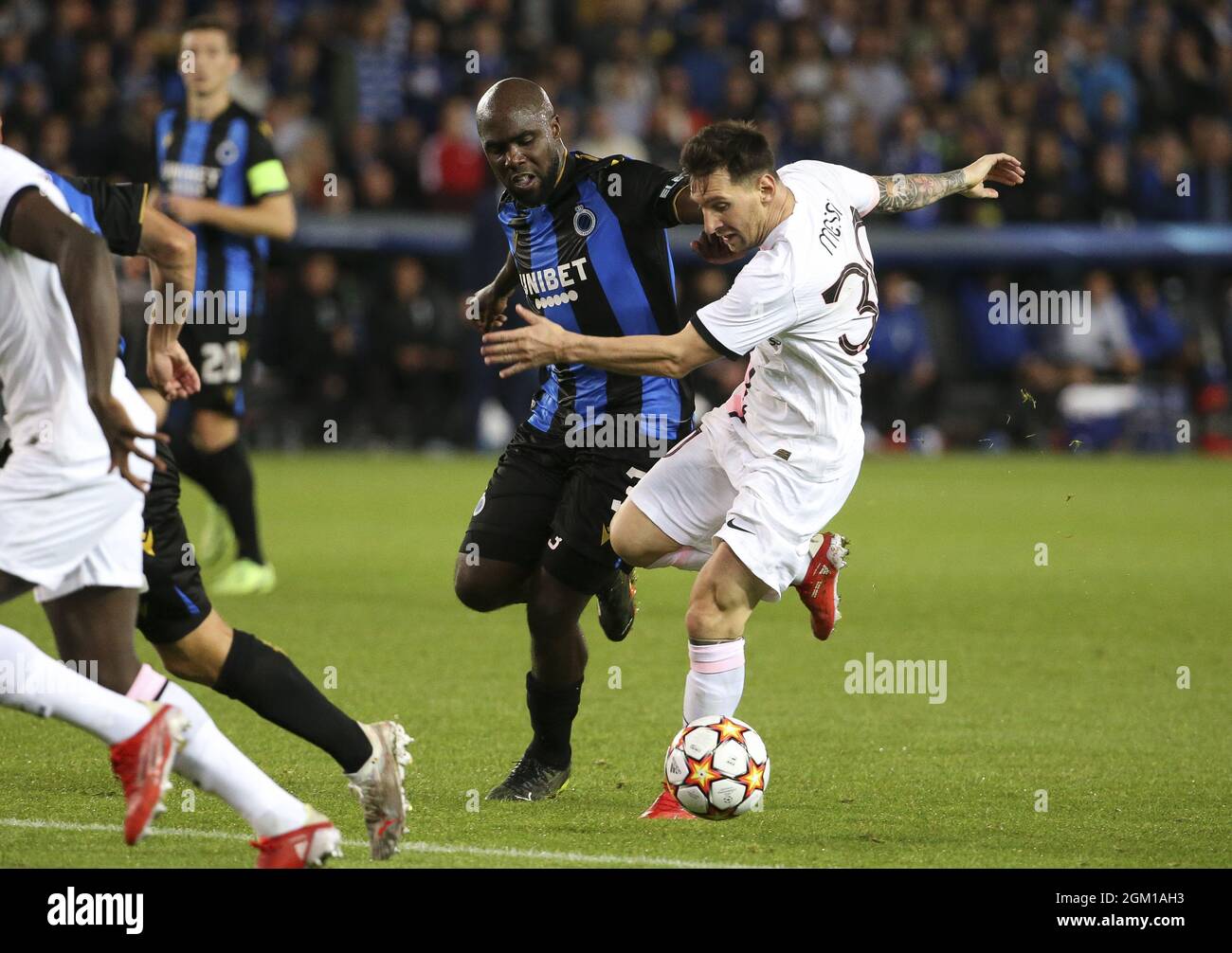 Lionel Messi of PSG, Eder Balanta of Club Brugge (left) during the UEFA Champions League, Group Stage, Group 1 football match between Club Brugge KV and Paris Saint-Germain (PSG)on September 15, 2021 at Jan Breydel Stadion in Bruges, Belgium - Photo: Jean Catuffe/DPPI/LiveMedia Stock Photo