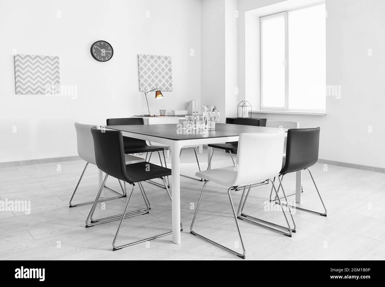 Modern room interior with big table and chairs Stock Photo - Alamy