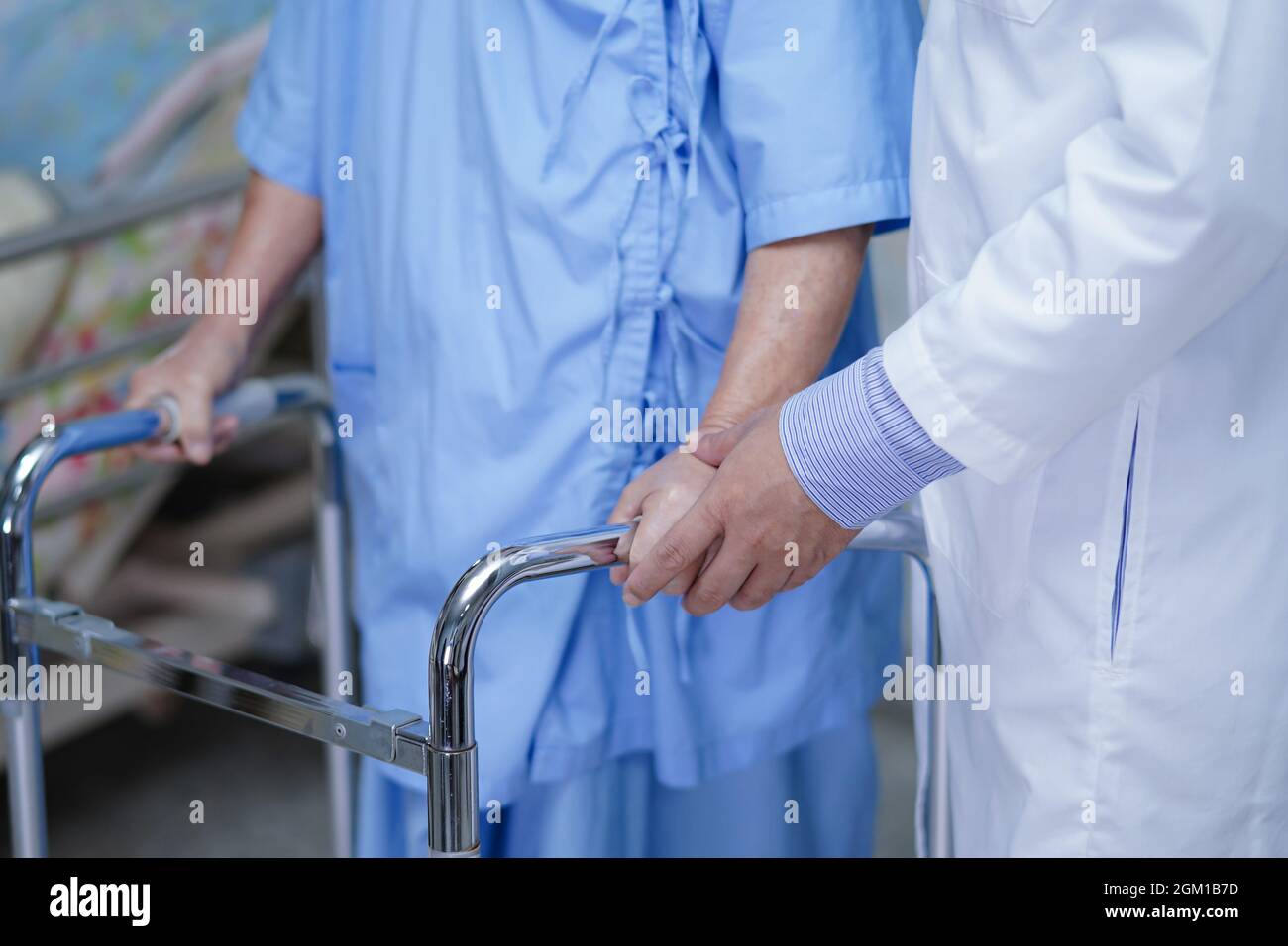 Doctor help Asian senior or elderly old lady woman patient walk with ...