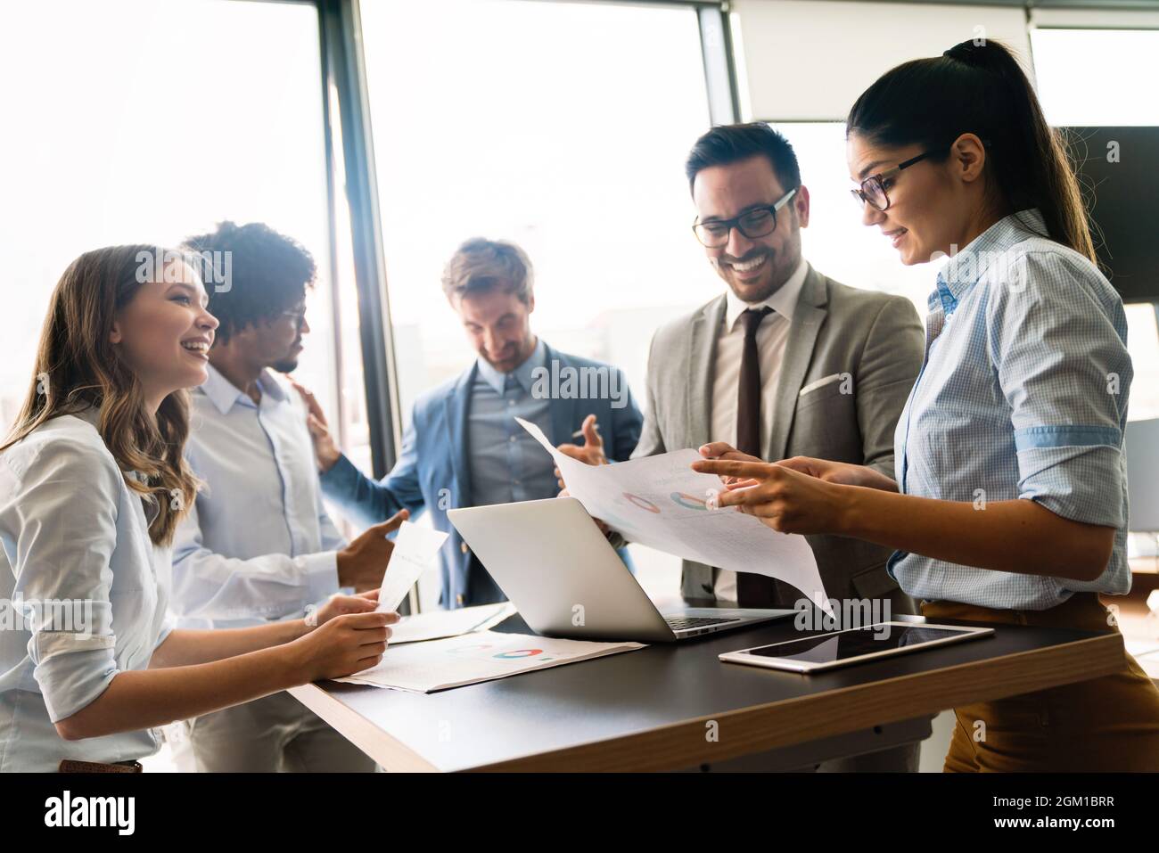 Portrait of successful business team working in office Stock Photo - Alamy