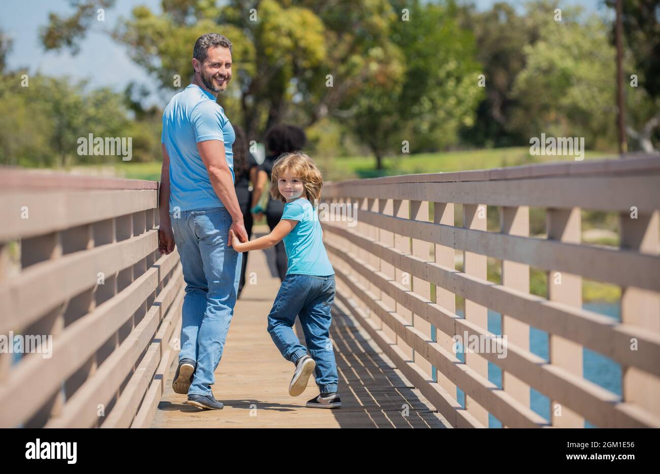 happy dad having fun with his son walking outdoor, parenthood Stock Photo