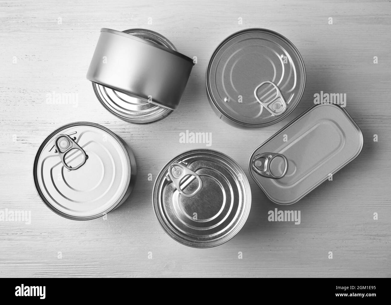 Tin cans on light background Stock Photo Alamy