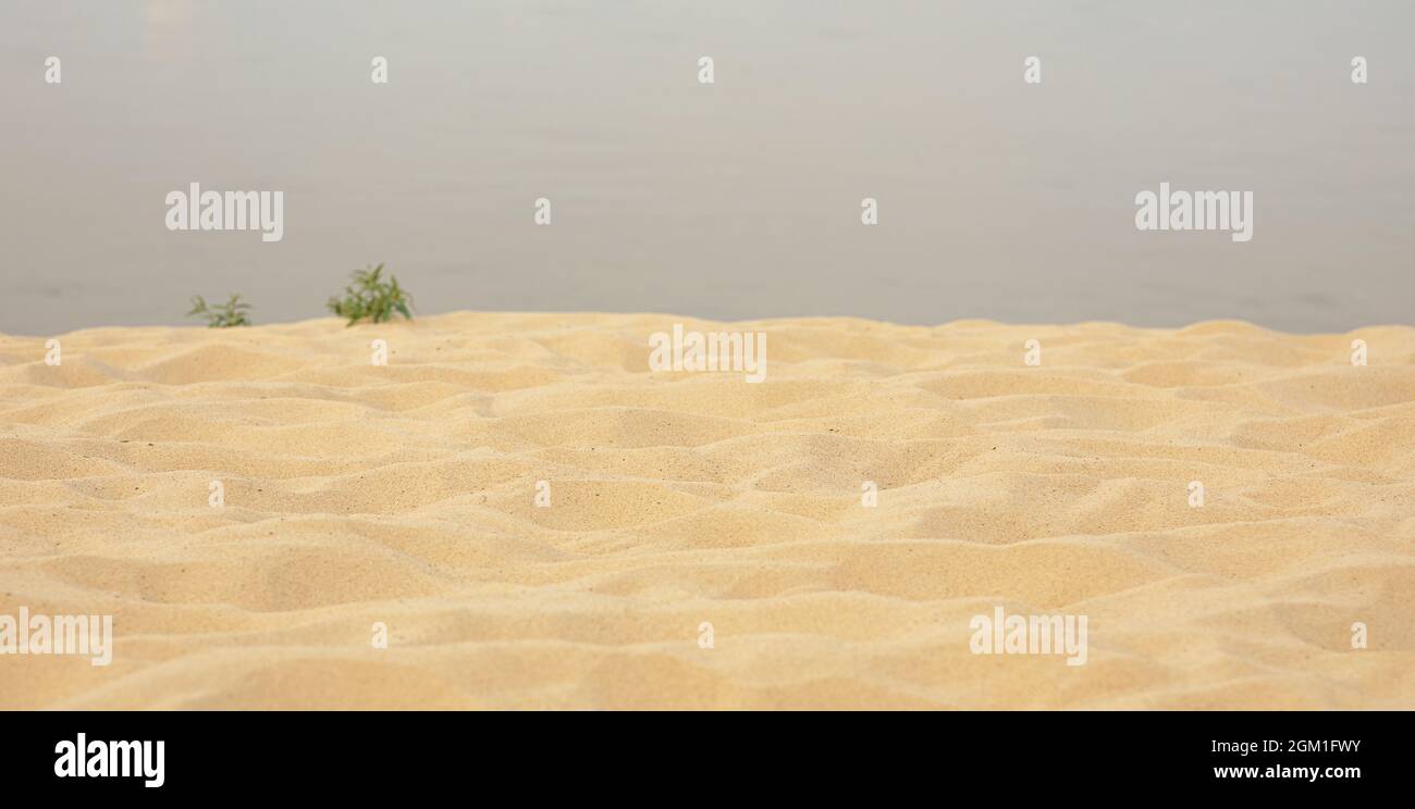 Sea sand beach summer day and water background, soft focus Stock Photo