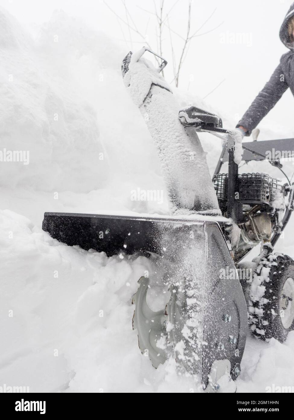 Clearing snow with a snowblower after a heavy snowfall Stock Photo Alamy