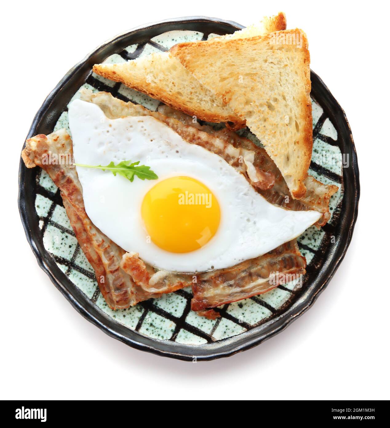 Plate with fried egg, bacon and toasts on white background Stock Photo ...