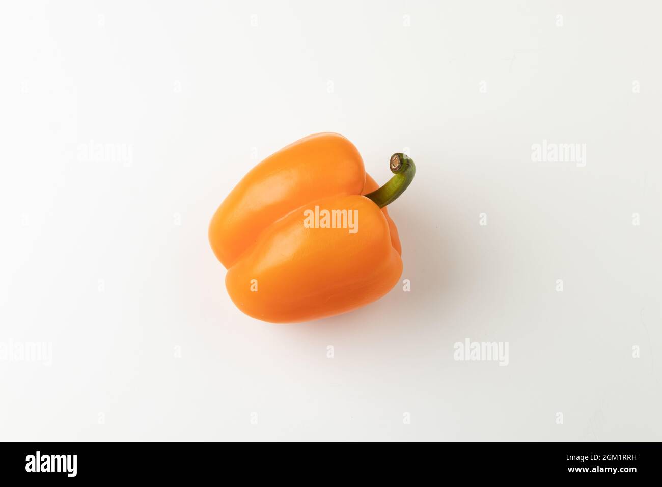 Orange bell pepper isolated on white background, top view, whole Stock Photo