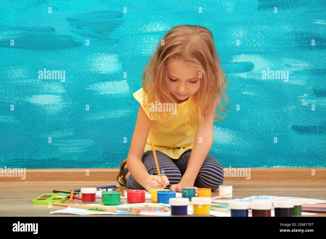Cute little girl painting at home Stock Photo Alamy