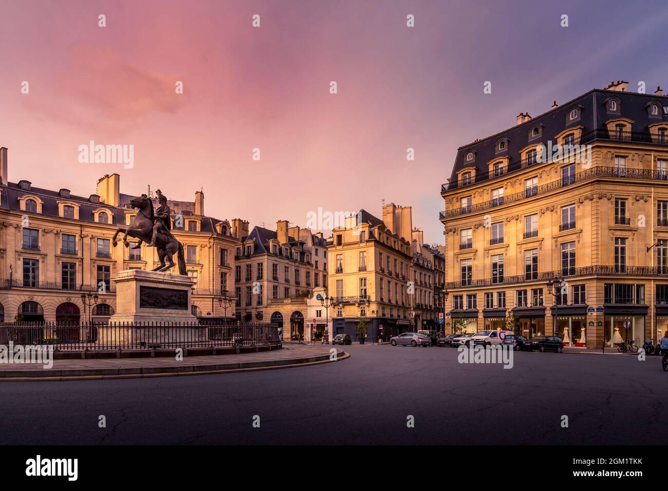 Paris, France - February 25, 2021: Beautiful buildings place des Victoires, typical parisian facades and windows Stock Photo