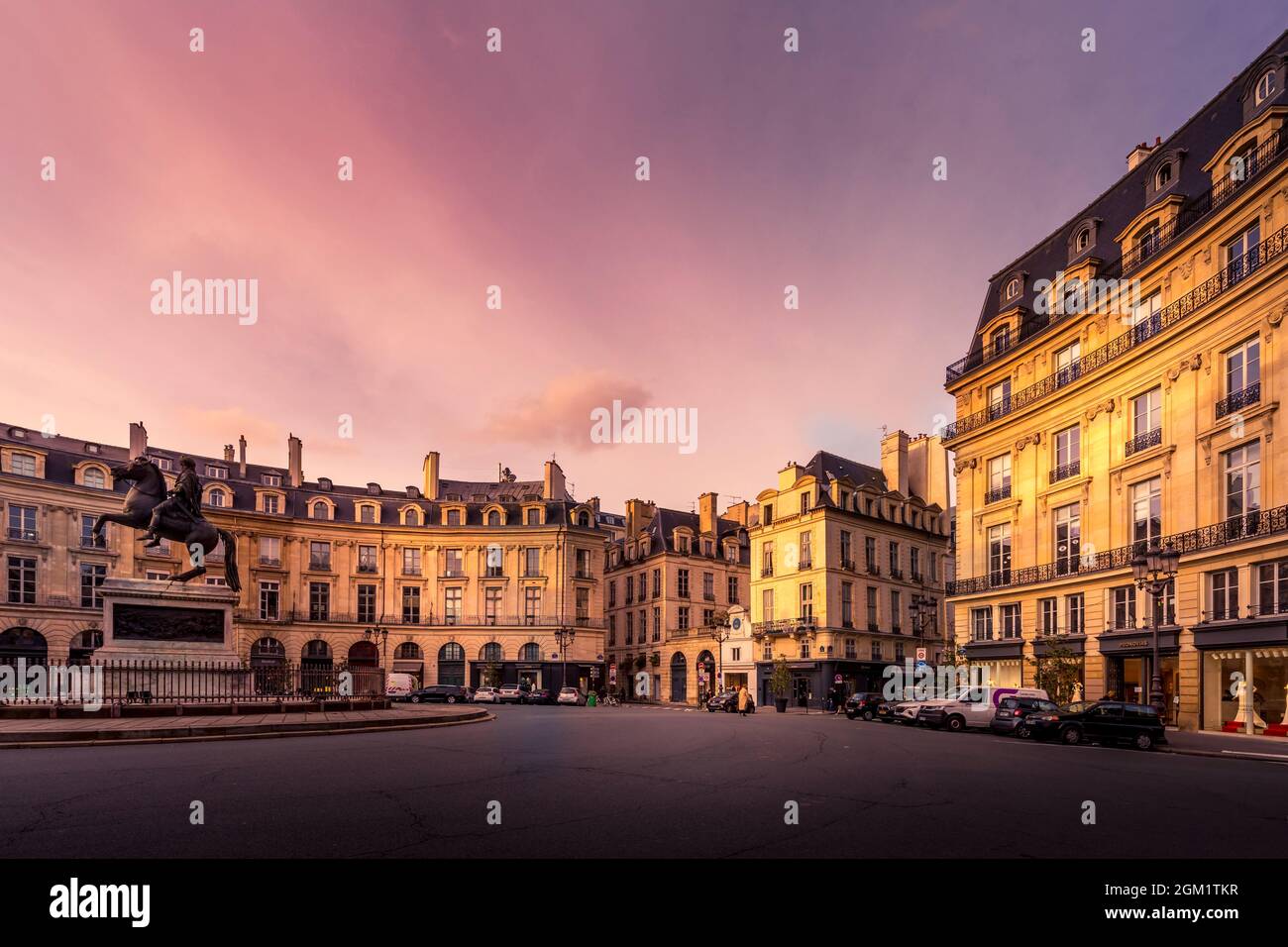 Paris, France - February 25, 2021: Beautiful buildings place des Victoires, typical parisian facades and windows Stock Photo