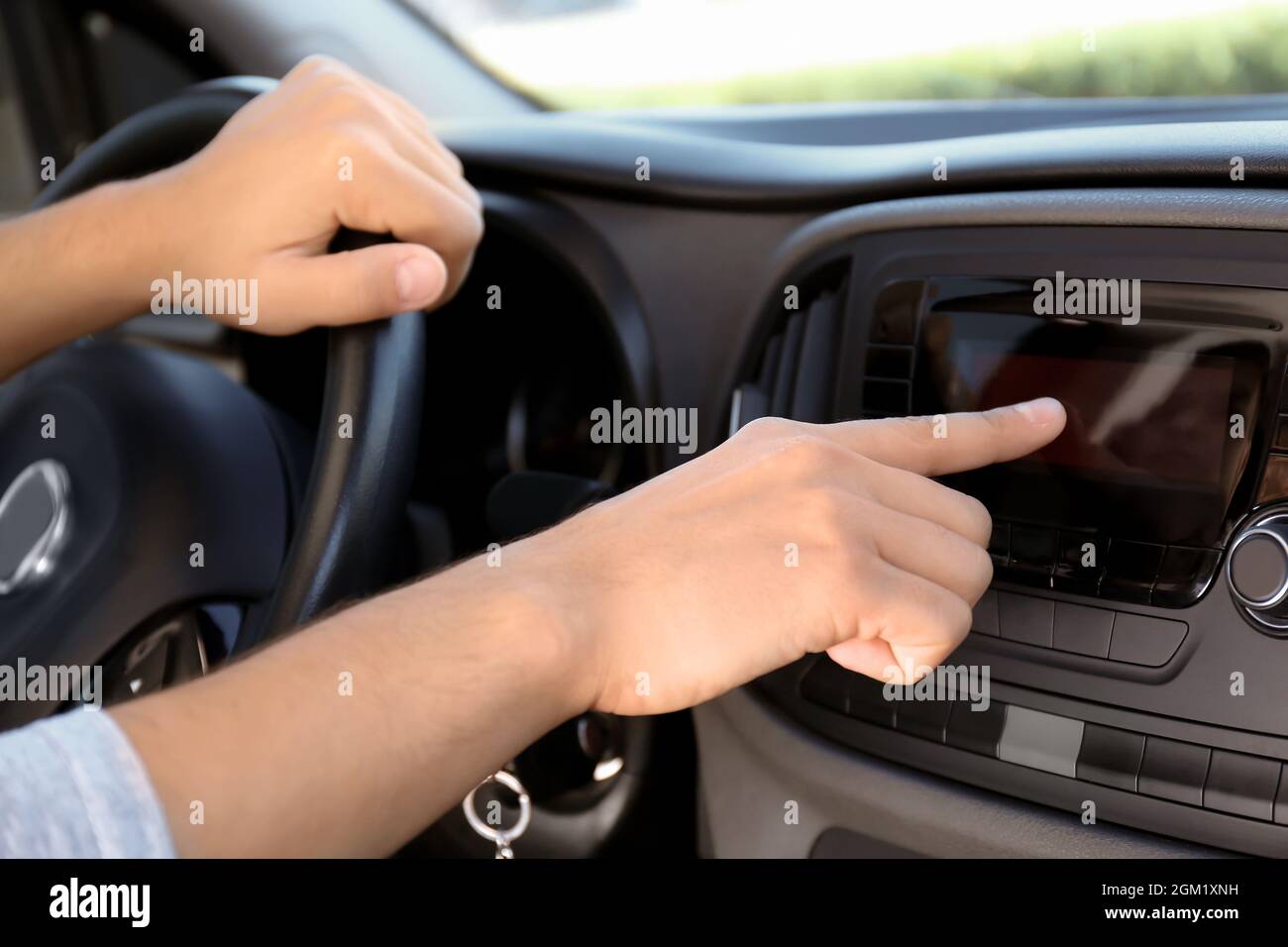 Man tuning car radio, closeup Stock Photo Alamy