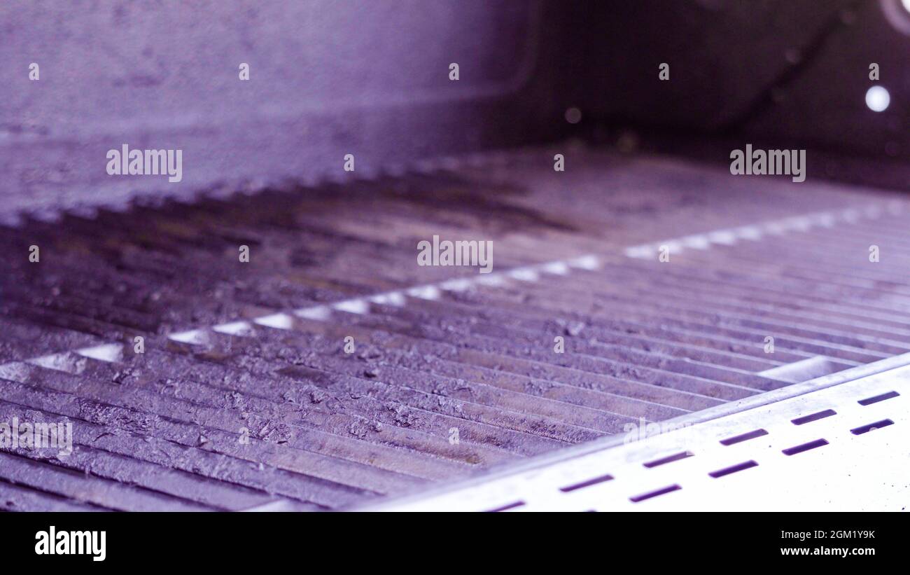 Close up view of cast iron grill grates of an outdoor gas grill Stock ...