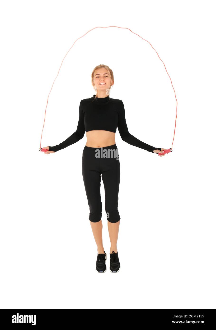 Sporty young woman jumping rope on white background Stock Photo Alamy